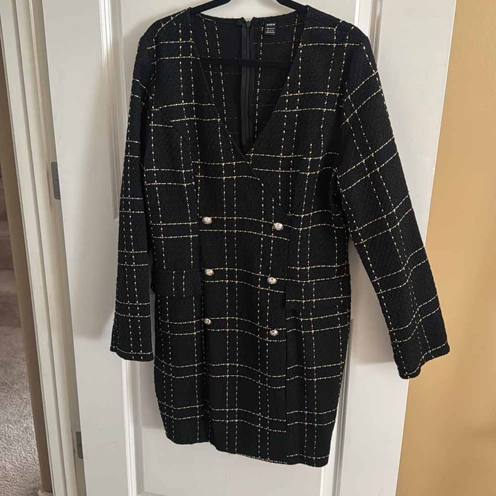 Women’s black and gold dress